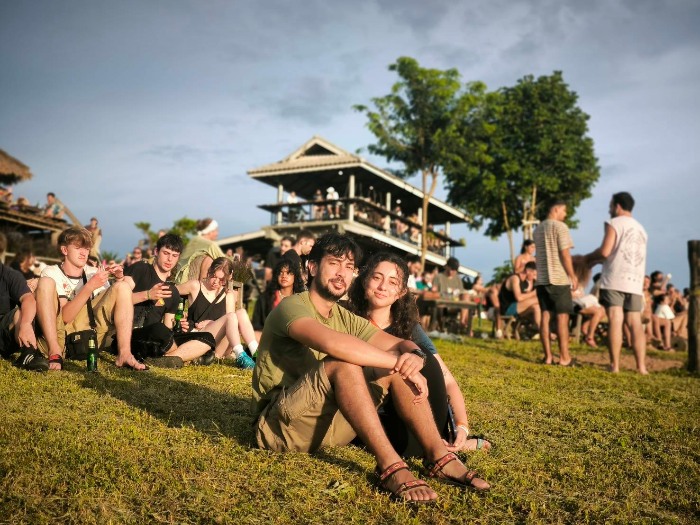 young man and woman in two huts pai thailand
